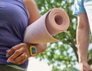 OT Selects R1 Page 21 Image 0001 close-up of senior woman holding a yoga mat outside