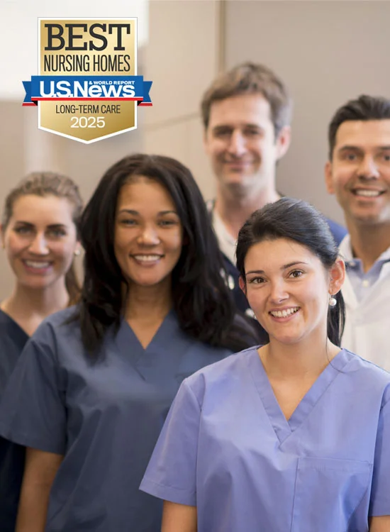 Smiling healthcare professionals in scrubs beside Best Nursing Homes 2025 badge.