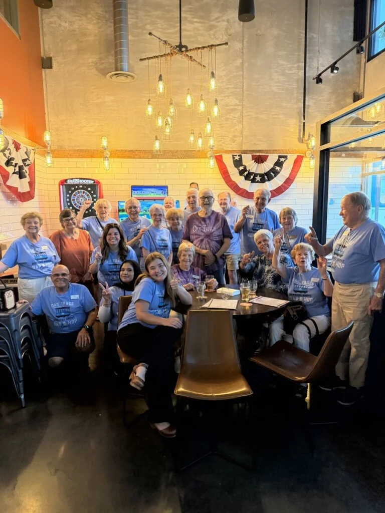 Oak Trace residents in themed shirts during the Downers Grove Trolley Bar Hop
