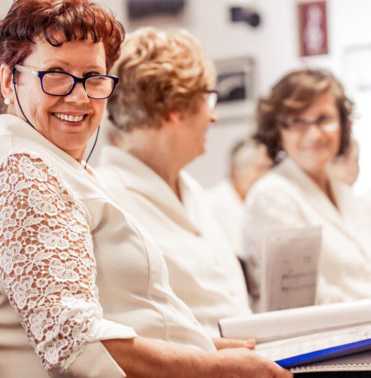 senior women smiling at book club