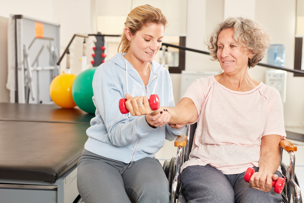 Senior woman doing physical therapy exercises