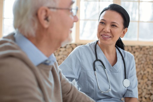 senior man talking with a nurse