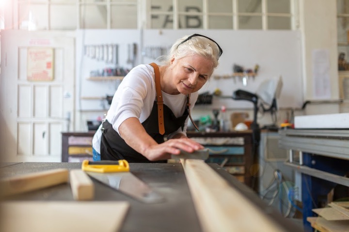 Senior woman woodworking