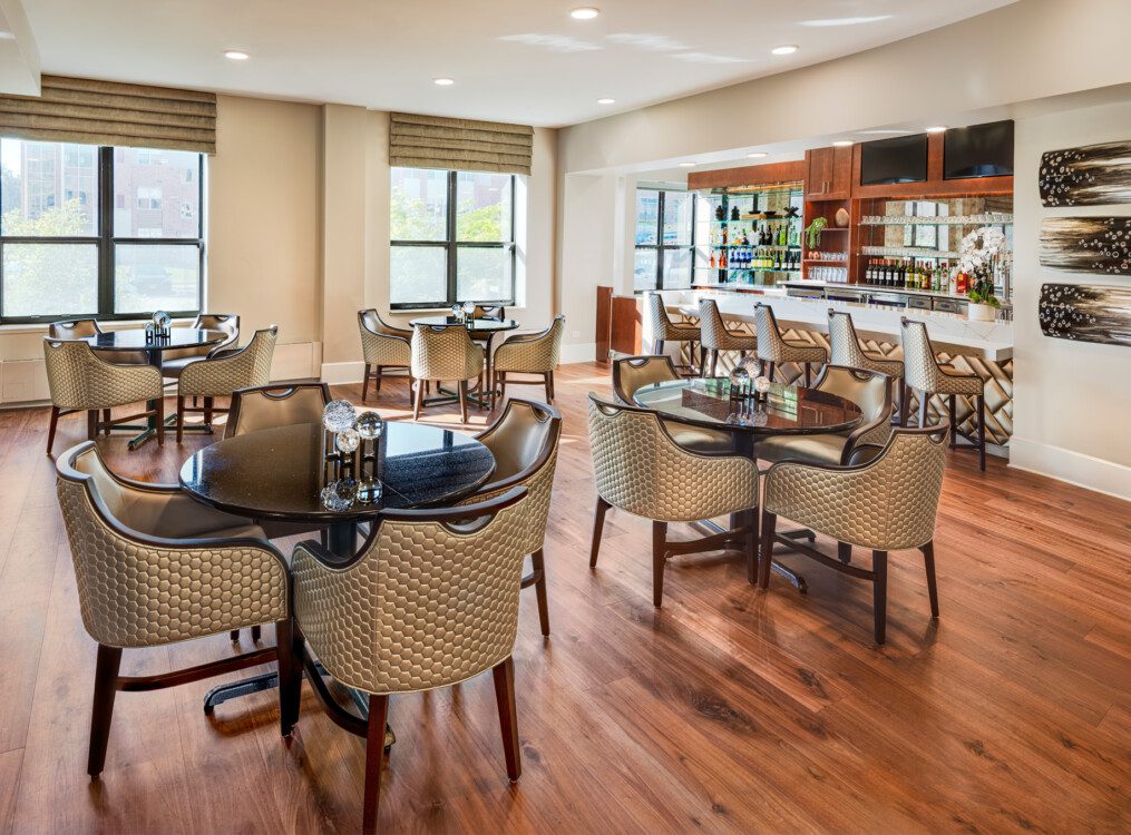Elegant dining room area with bar at Oak Trace Senior Living Community