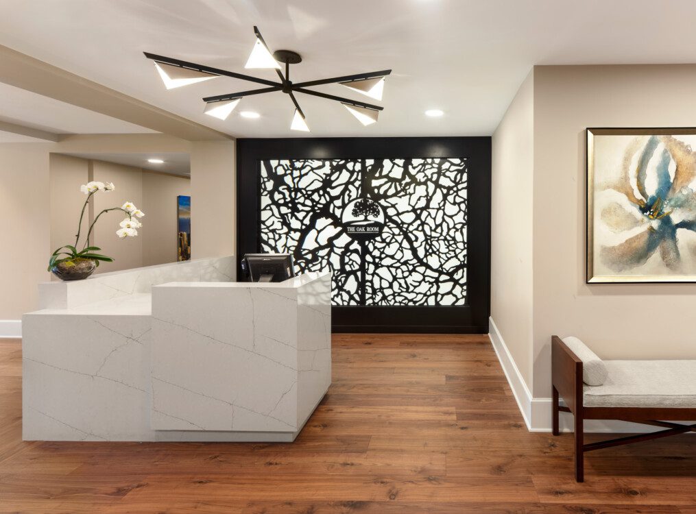 Modern and sophisticated check-in area at Oak Trace Senior Living Community