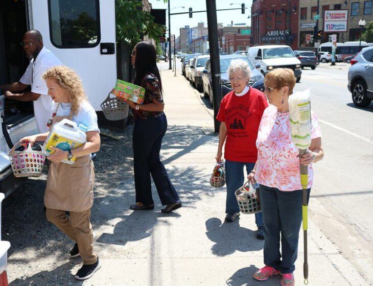 group of seniors help deliver donated supplies to charity