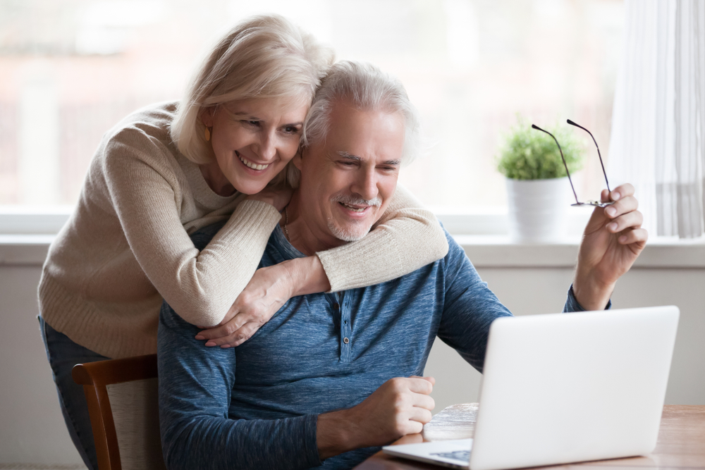 Senior couple looking at a computer