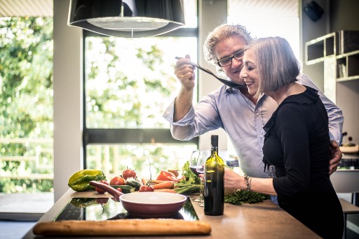 senior couple cooking in their independent living apartment