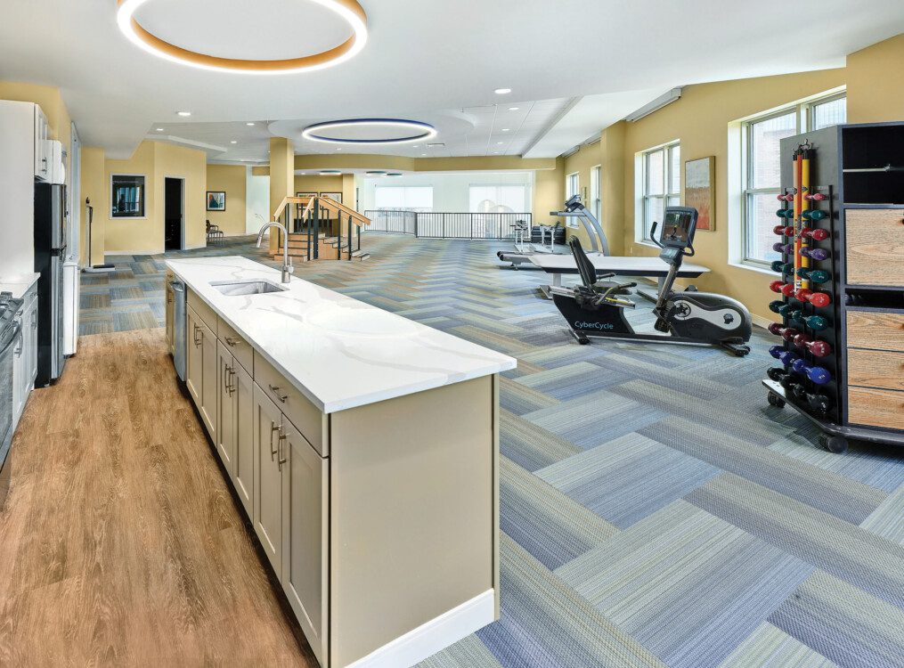 expansive senior physical therapy and wellness room with gym equipment