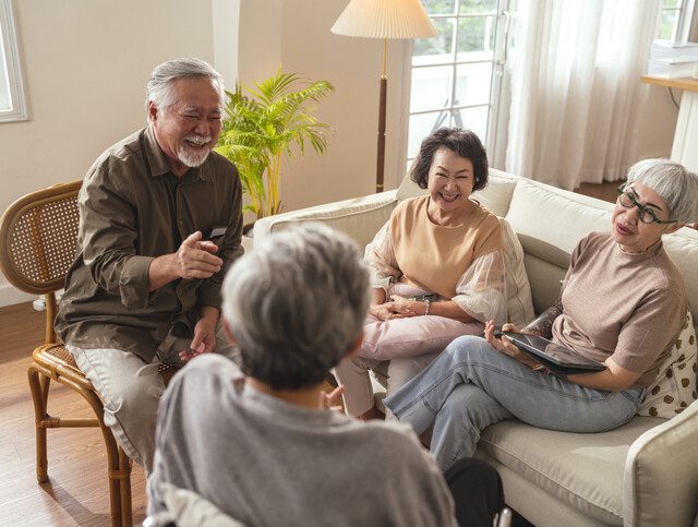 old senior asian friends retired people hapiness positive laugh smile conversation together at living room at nursing home Seniors participating in Group Activities in Adult Daycare Center