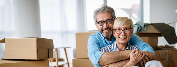 Portrait of happy smiling senior couple in love moving in new home Portrait of happy senior couple in love moving in new home